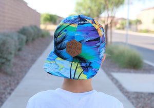 Blue Hawaiian pattern toddler and kids size snapback baseball cap with flat brim and faux leather logo patch