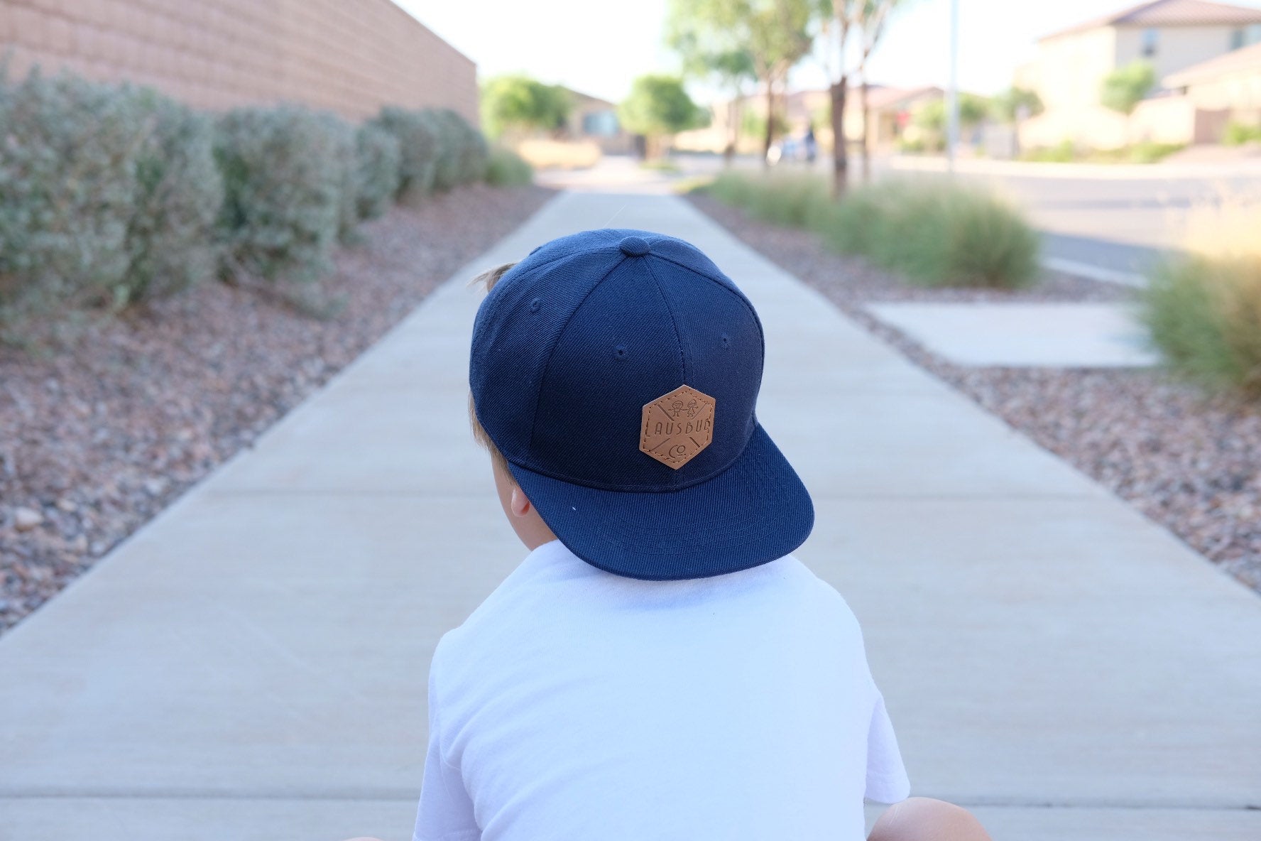 Navy blue toddler and kids snapback baseball cap with faux leather logo patch, great cap for babies and toddlers!