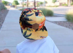 Yellow Hawaiian pattern toddler and kids size snapback baseball cap with flat brim and faux leather logo patch