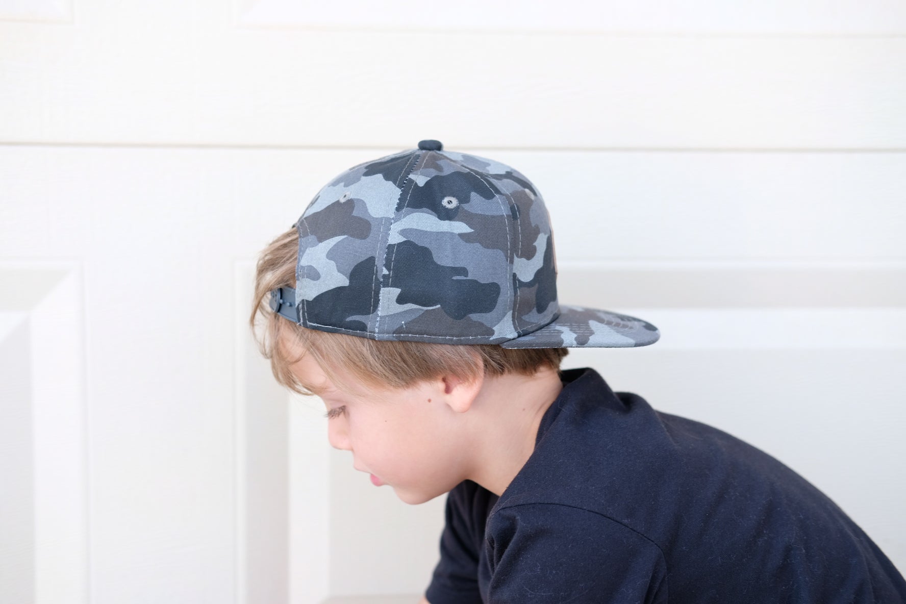 Gray camo toddler and kids size snapback baseball cap with flat brim and faux leather logo patch