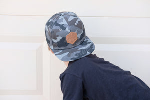 Gray camo toddler and kids size snapback baseball cap with flat brim and faux leather logo patch